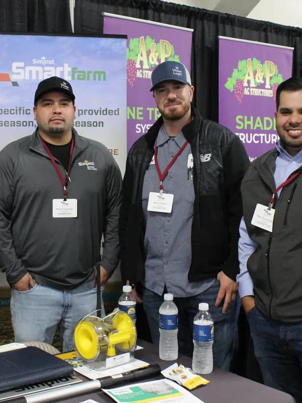 Exhibitors at their stand on the trade show floor